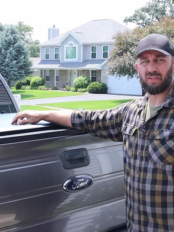 Big Mike next to his F-150 with the Rough Country tonneau cover