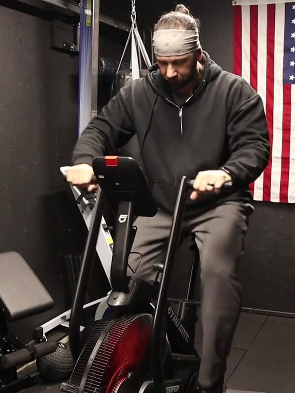 Big Mike on the Tru Grit Reaper air bike in his home gym